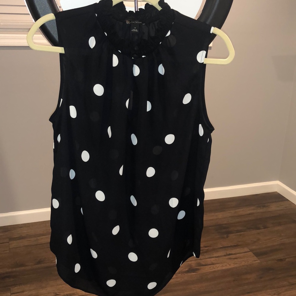 Black sleeveless blouse w/white Polka Dots